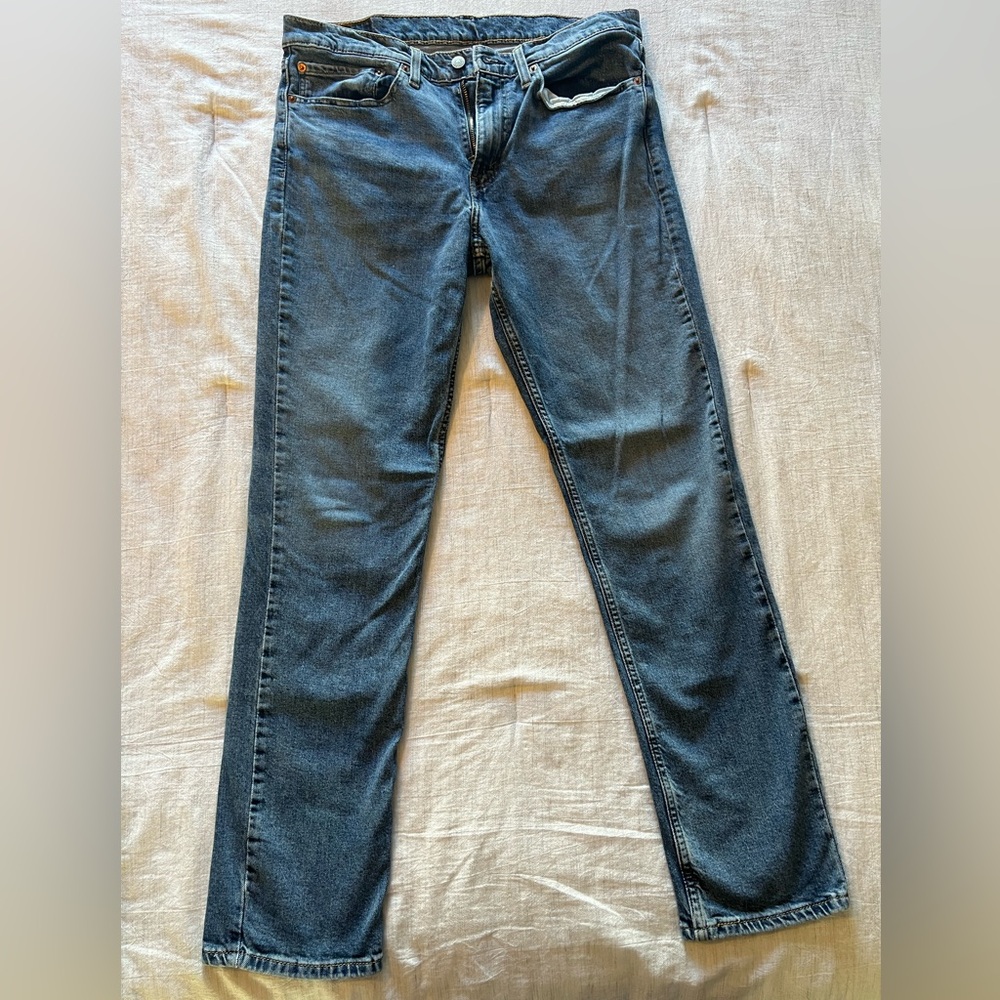 Levi’s 511 stone washed blue jeans. Side W34, L32.